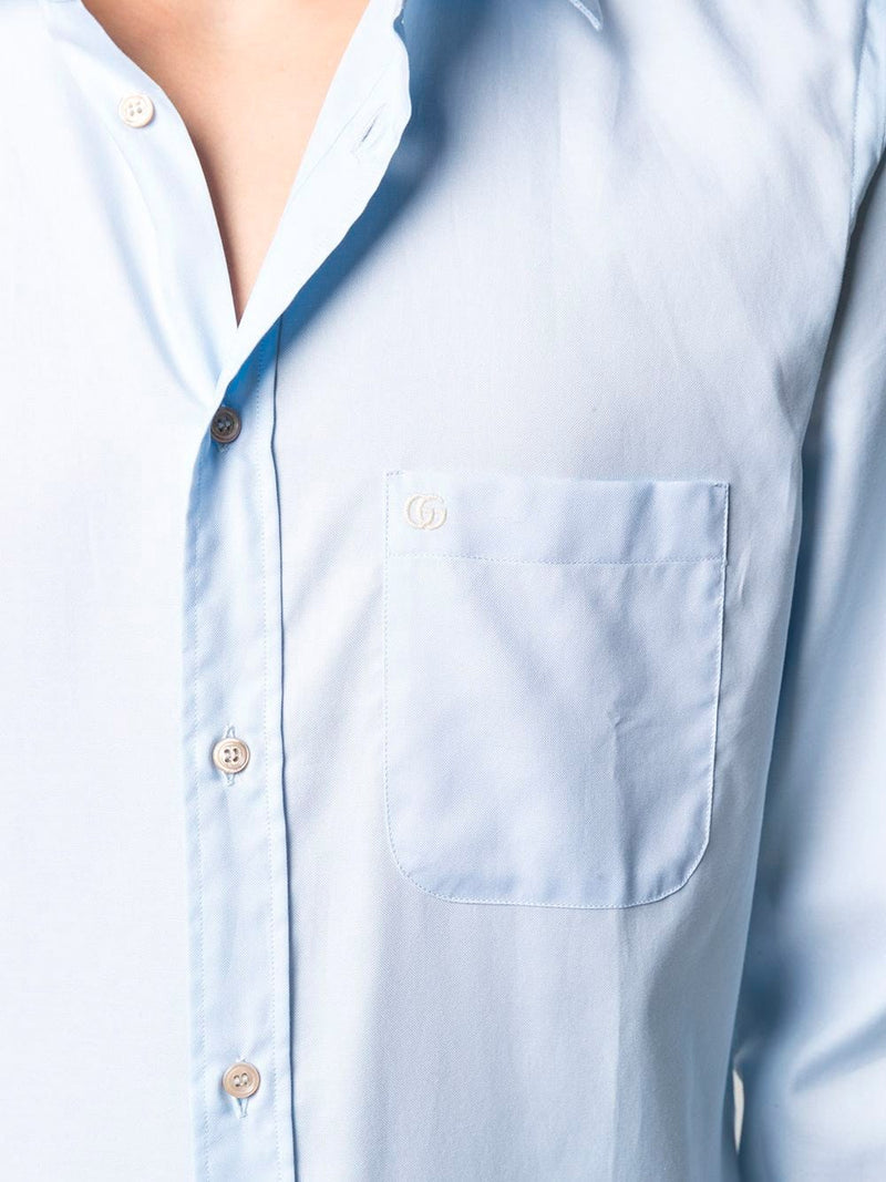 Light blue shirt with embroidered logo